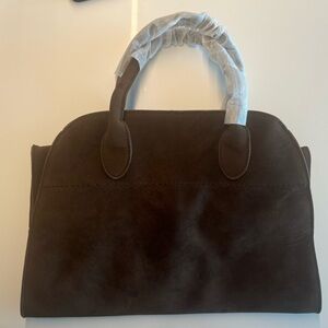 Viral brown faux suede handbag.